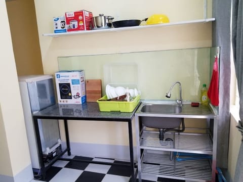 Fridge, electric kettle, cookware/dishes/utensils, paper towels