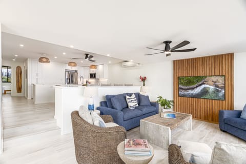 Living Space - Open concepts and large accordion doors let plenty of light into the space.