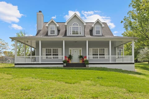 Front of the house with wrap around porch....faces the water.
