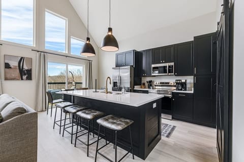 Easily prepare meals, coffee, and cocktails and walk outside to enjoy the sunrise, afternoon lunch, or evening supper