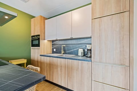 Wake up to a modern kitchen with all the essentials at hand.