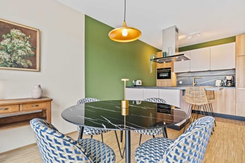 Dine in style with our sleek kitchen and table setting.