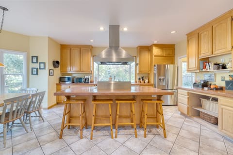 Kitchen boasts an island with barstool seating.