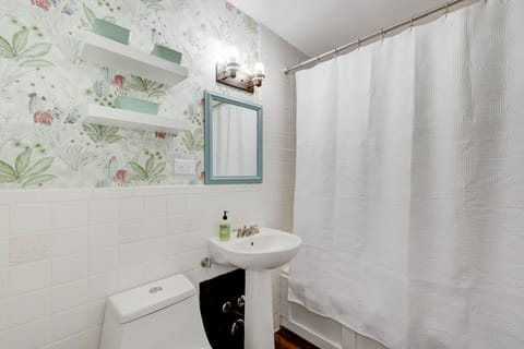 Combined shower/tub, hair dryer, towels, soap