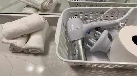 Hair dryer, towels, soap, shampoo