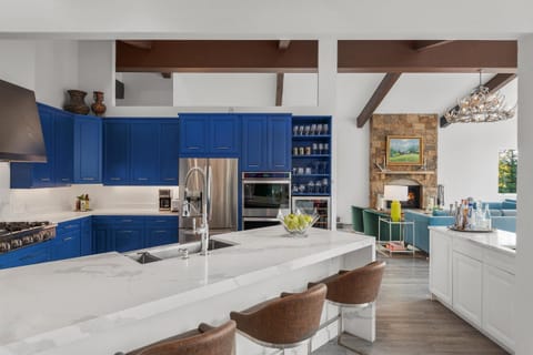 Island seating for easy entertaining & visiting, 100 bottle wine fridge & bar