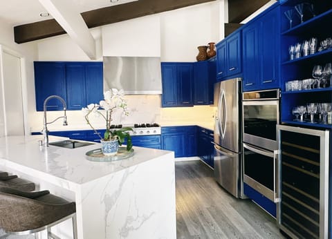 Large chef's kitchen with every imaginable appliance, double oven, wine fridge