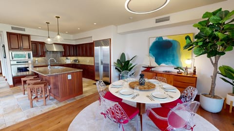 Dining table for 6 with additional seating for 3 at the island