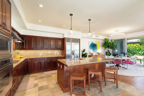 Spacious gourmet kitchen with additional island seating for quick meals