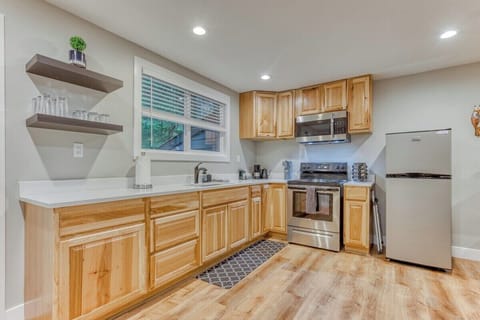 Spacious full kitchen with stainless steel appliances, large counters, and all the essentials—perfect for cooking during your vacation or extended stay.