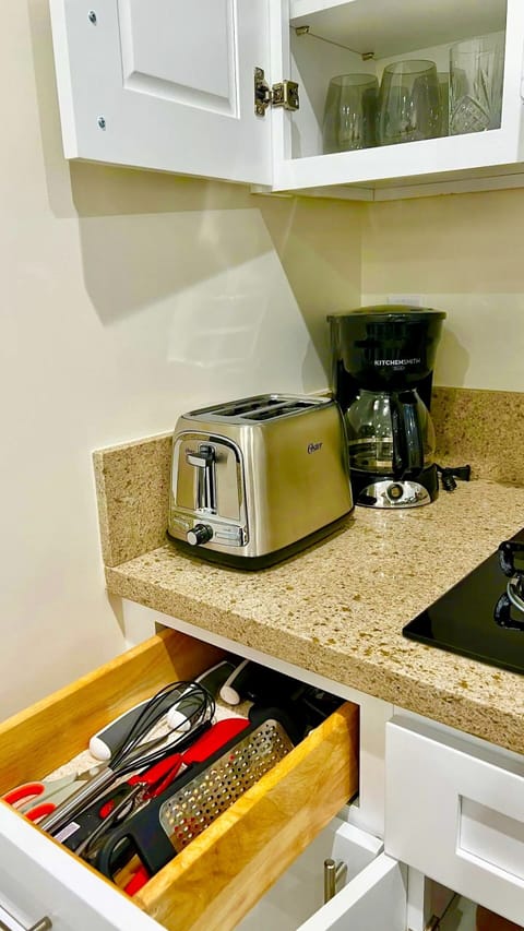 Fridge, microwave, stovetop, coffee/tea maker