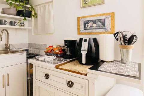 Fridge, coffee/tea maker, toaster, cookware/dishes/utensils