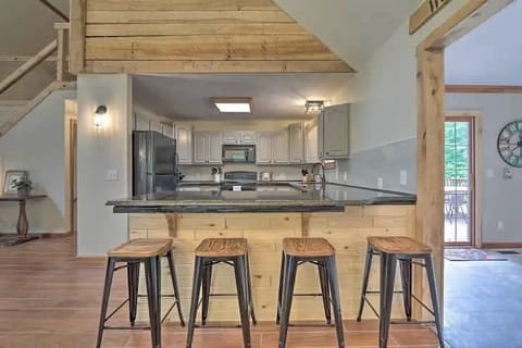 Prepare delicious meals in our fully-equipped kitchen with its spacious countertops, modern appliances, and a breakfast bar that's perfect for savoring morning coffee or casual dining.