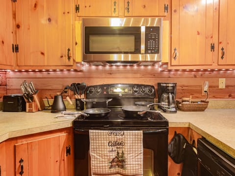 Cookingware is down the cabinet just to the left of the stove.

