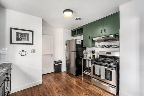 Stainless steel appliances in the open kitchen.
