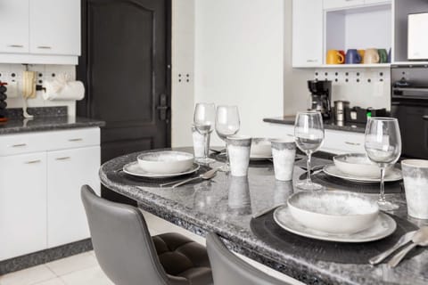 Enjoy meals together in a sleek dining space designed for comfort and style.