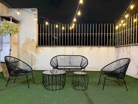 A lovely area outside with Acapulco style chairs
