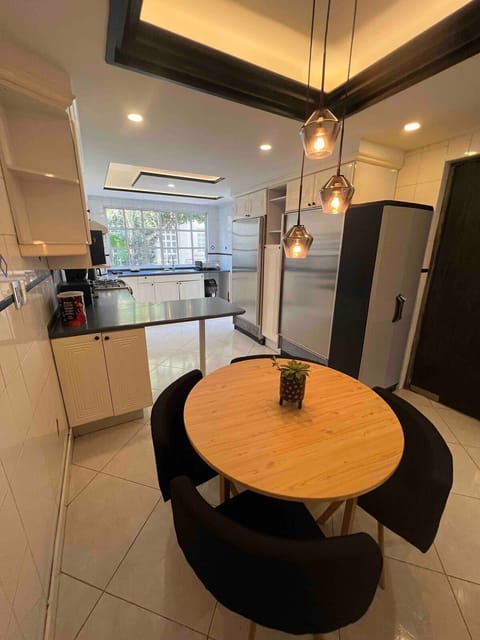 There’s also a kitchen table for 4 and a breakfast bar area