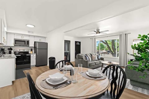 Open dining area seamlessly connects to the kitchen and living space—ideal for gathering over meals.