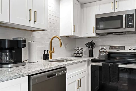 Fully stocked kitchen featuring a Keurig, toaster, and essential cookware—perfect for preparing home-cooked meals.