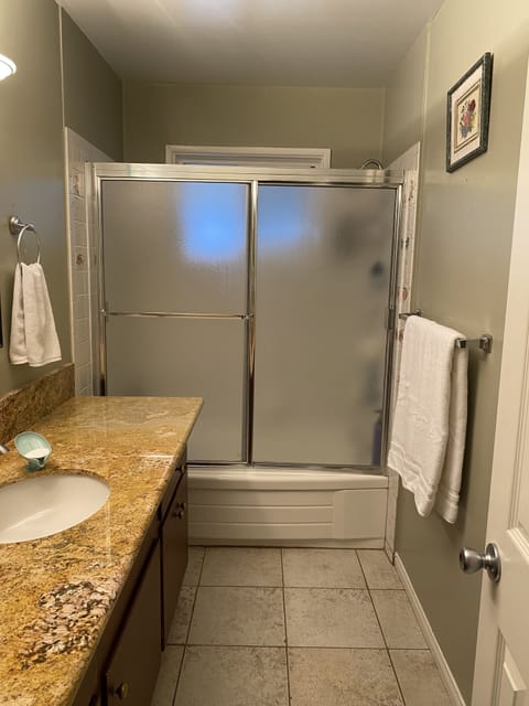 Combined shower/tub, hair dryer, towels, soap