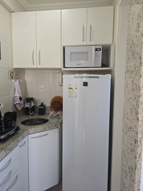 Fridge, microwave, stovetop, cookware/dishes/utensils