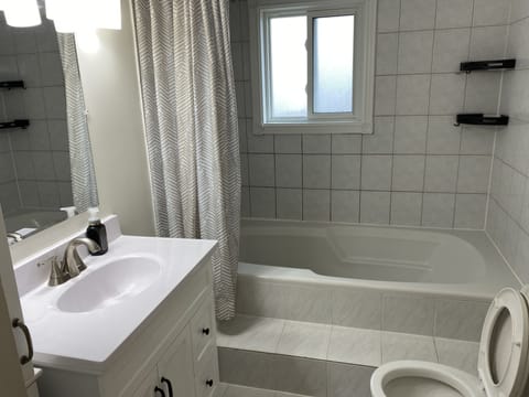 Combined shower/tub, hair dryer, towels, soap