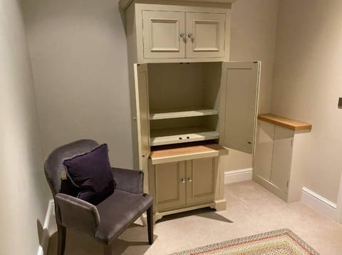 Cupboard in hallway opens out into handy desk!