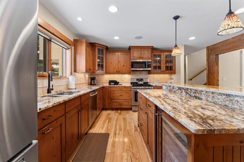 Full size kitchen featuring stainless steel appliances and granite countertops.