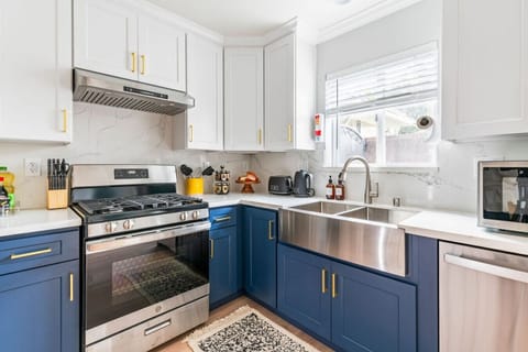 Discover the heart of our home: our fully-equipped kitchen boasts top-of-the-line appliances and all the essentials you need to whip up delicious meals during your stay.