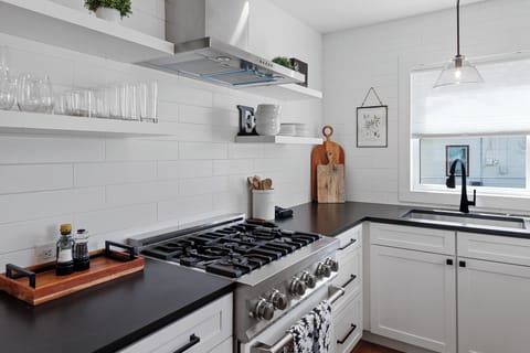 Kitchen with all the essentials, including a Keurig and a French press.