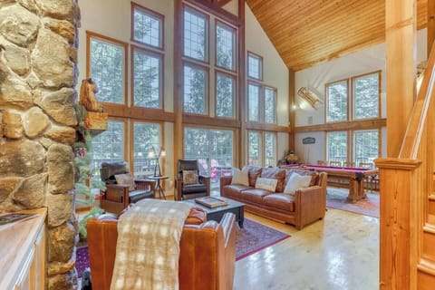 Relax in the spacious living room, bathed in natural light from the expansive windows, soak in nature and visit with friends and family.