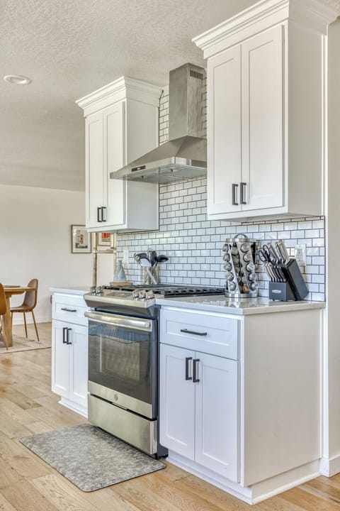 Bright white kitchen with a dishwasher! Easy cooking and cleanup for your stay.
