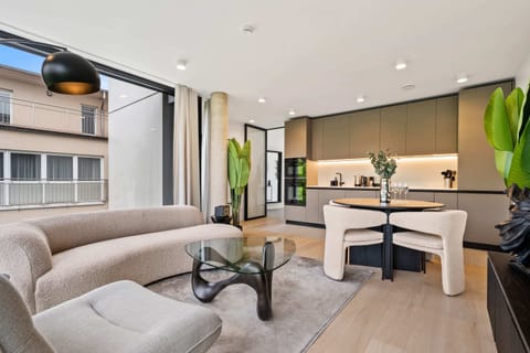 Seamless living: from plush sofa to sleek kitchen, find your flow.