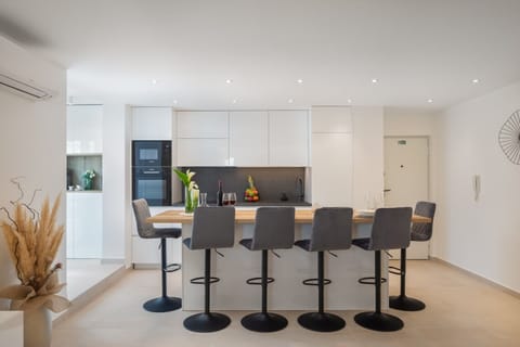 Fully equipped kitchen with a kitchen island in a luxury apartment in the center of Split

