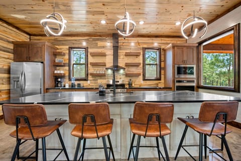 Whip up delicious meals in this spacious kitchen that blends rustic charm with modern amenities.