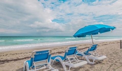 On the beach, sun loungers, beach towels