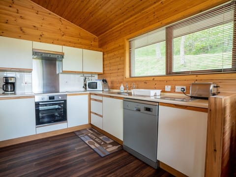 Cabinetry, Countertop, Property, Kitchen Appliance, Home Appliance, Kitchen, Kitchen Stove, Window, Wood, Interior Design