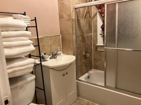 Combined shower/tub, towels, soap, shampoo