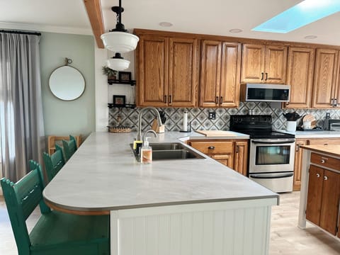 Plenty of counter space in the kitchen. Three chair bar seating. 