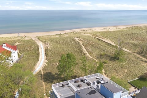 Relax above the dunes with spacious rooftop seating and easy access to the beach below