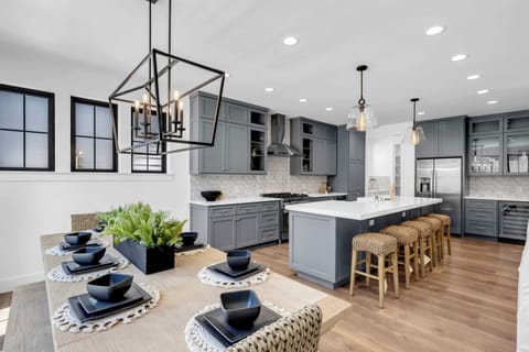 Space for 5 guests at the kitchen island and 8 guests at the dining room table