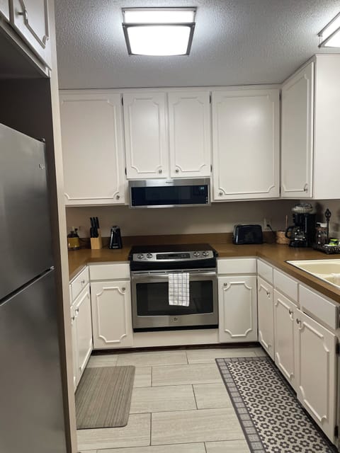 Kitchen with stainless steel appliances.