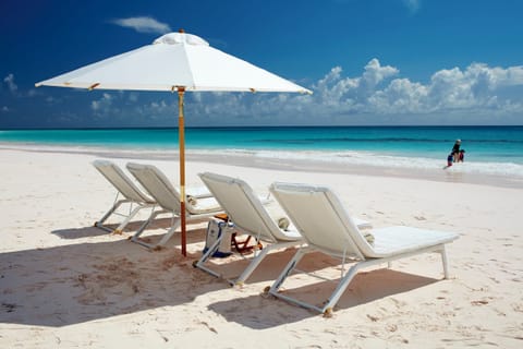 On the beach, sun loungers, beach towels