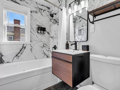 Bathtub, jetted tub, hair dryer, towels