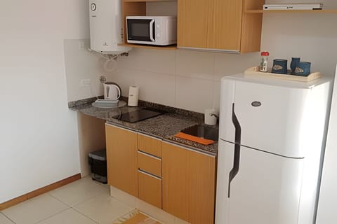 Fridge, microwave, coffee/tea maker, toaster