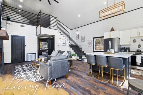 Our living room, featuring a cozy loft and elegant interiors, is the ideal place to unwind and gather.