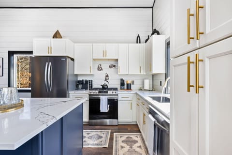 Prepare your favorite meals in our fully equipped kitchen, where elegance meets functionality for your culinary adventures.