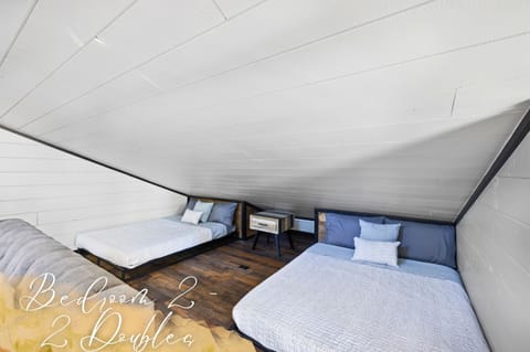 Sleep soundly in our loft bedroom, where two plush double beds await to provide a peaceful retreat from your day's adventures.