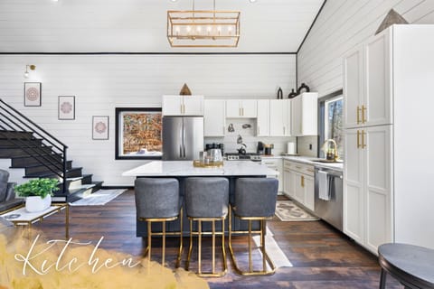 Our kitchen is ready for your culinary adventures, blending modern amenities with sleek design for a delightful cooking experience.